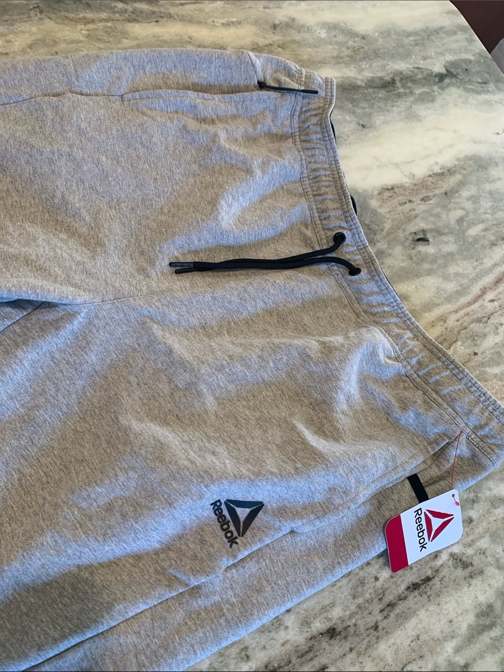 Reebok Men’s Light Gray Athletic Shorts with Black Drawcord